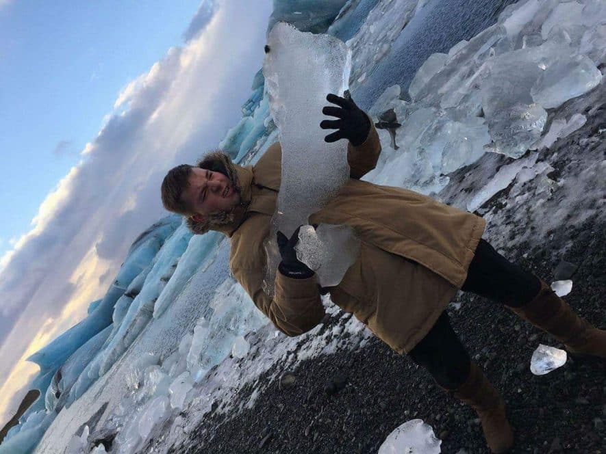 man holding ice block
