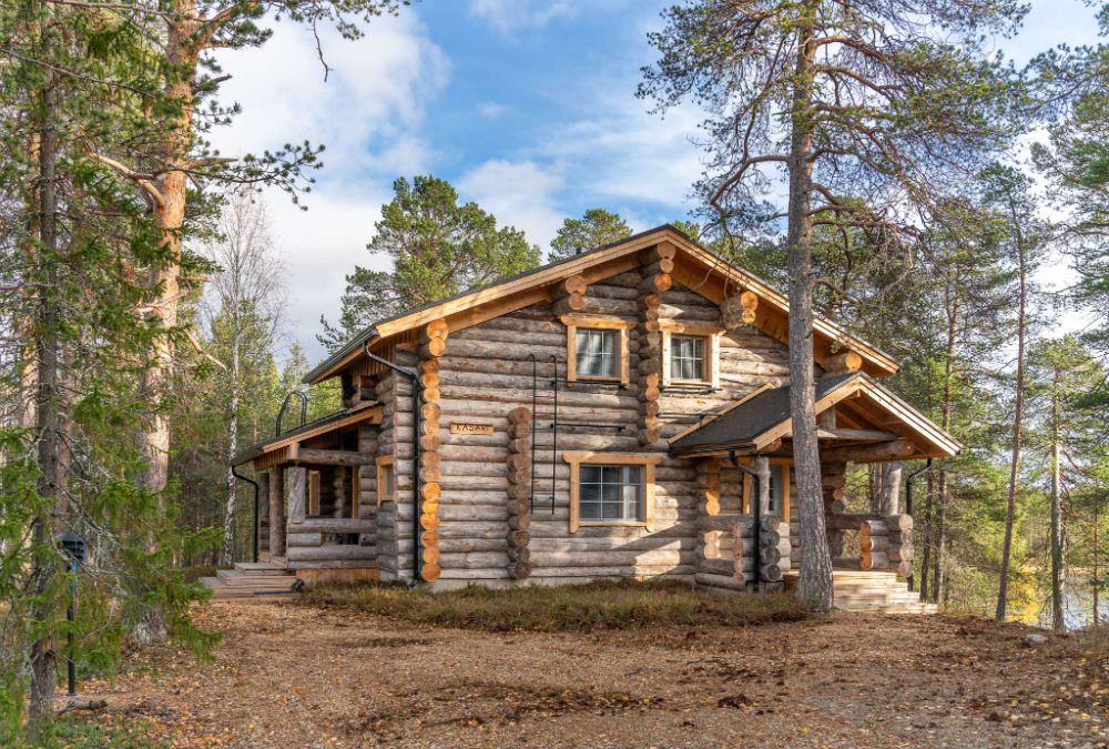 log cabin in the woods in the summer