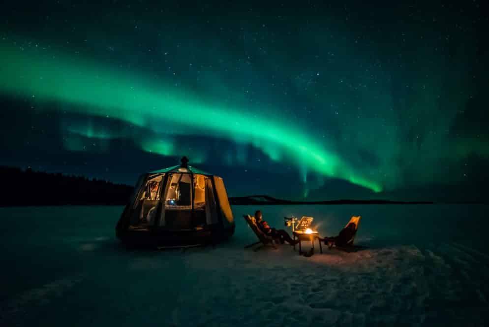 aurora hut with northern lights above