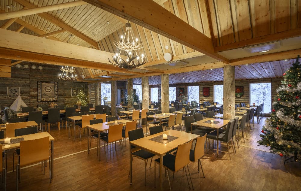 dining area in a restaurant with christmas tree