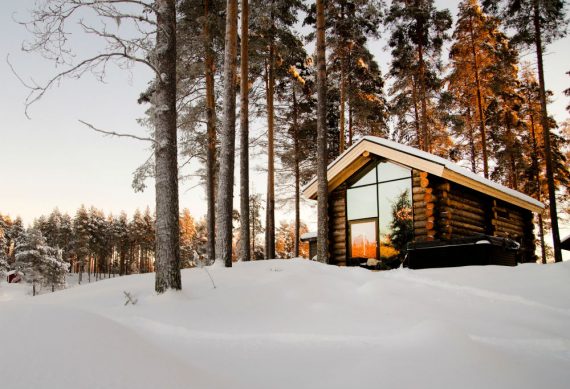 log cabin in the snow and large window