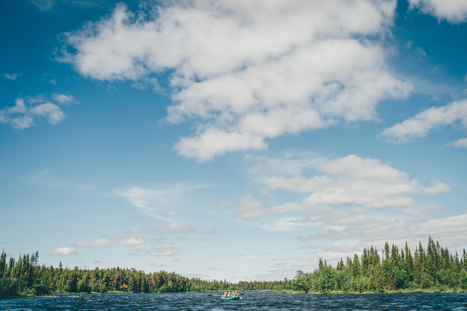 boat on the river surrounded by trees