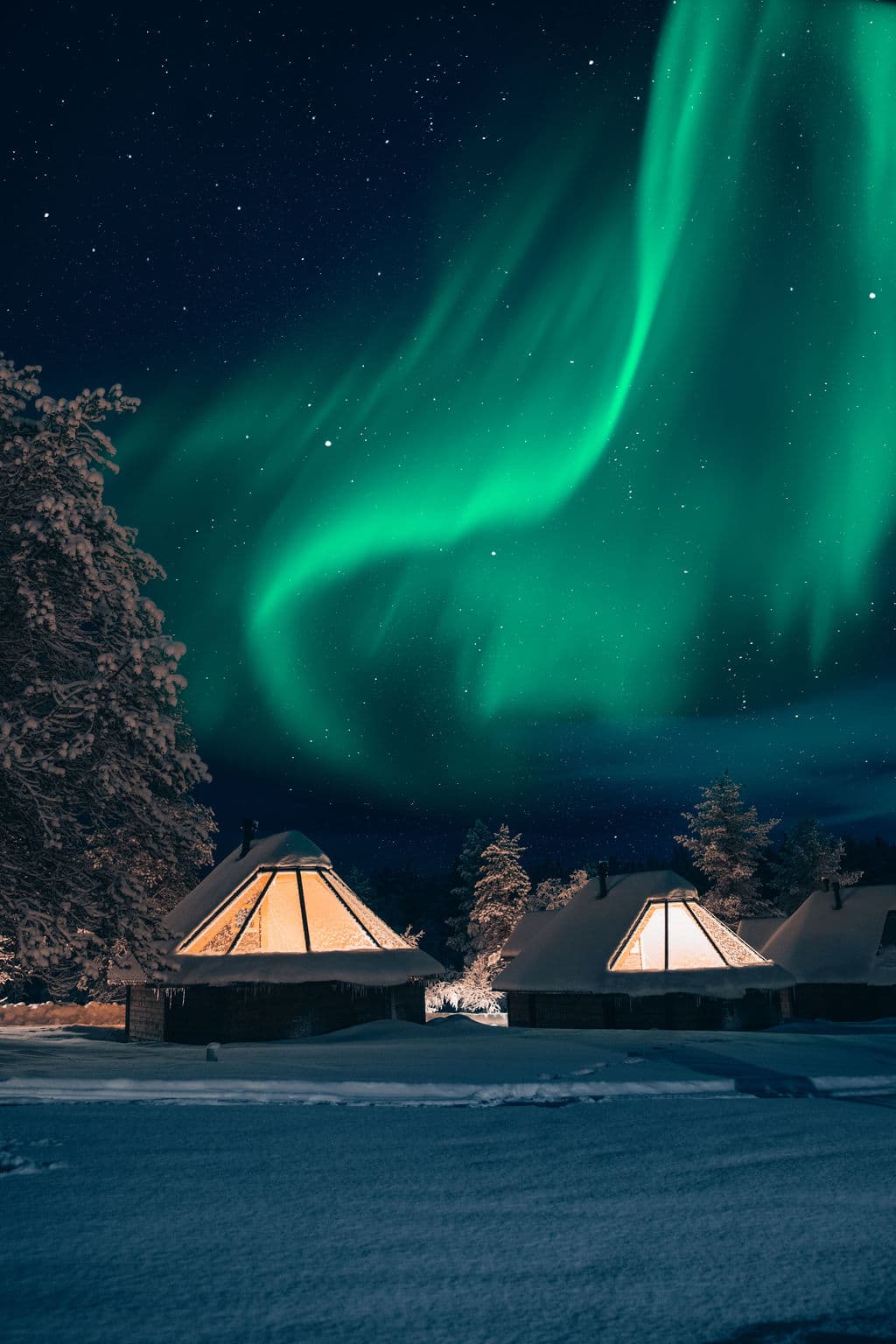 northern lights above glass igloos
