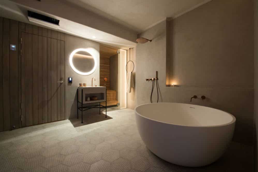 bathroom with freestanding bath and sauna