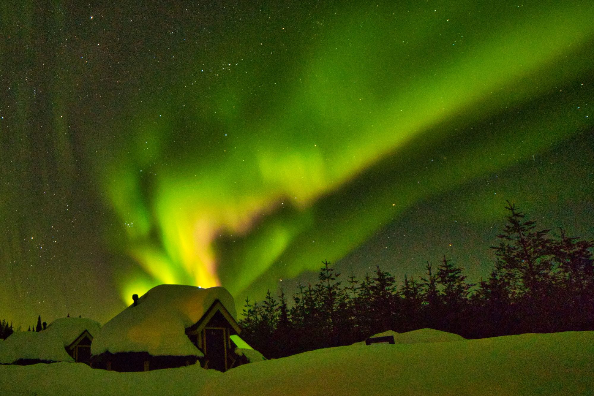 northern lights above cabin