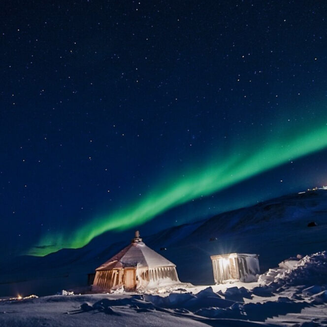 northern lights above cabin