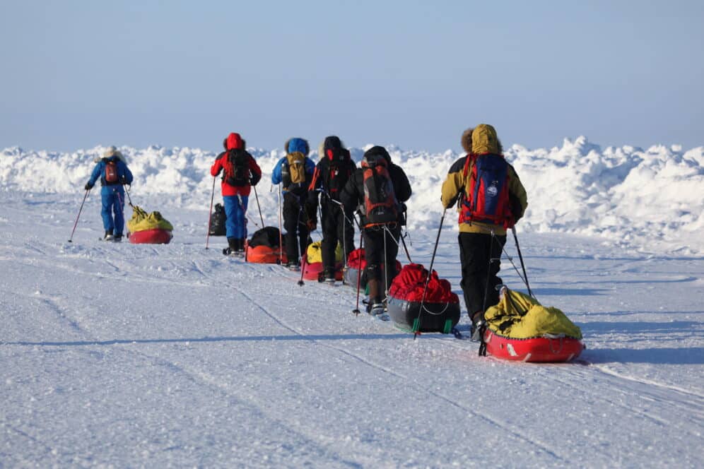 people walking in the north pole