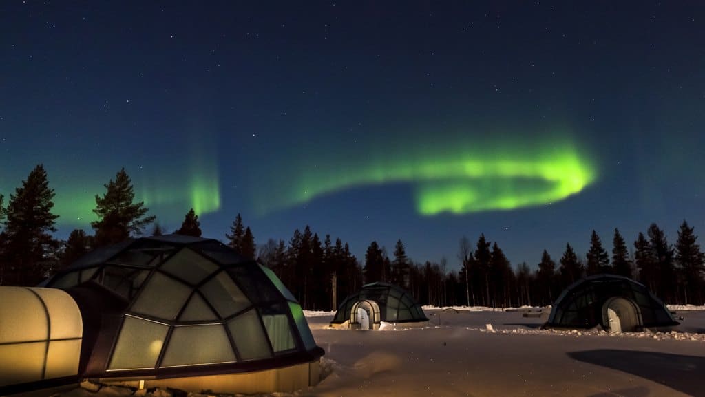 northern lights above glass igloos