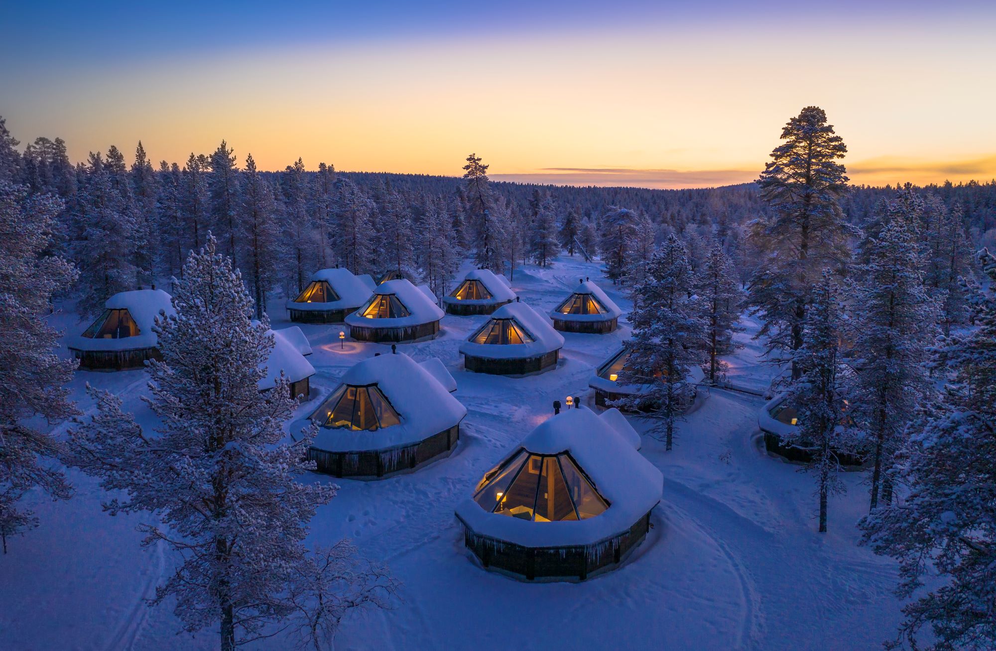 glass roof cabins in the forest