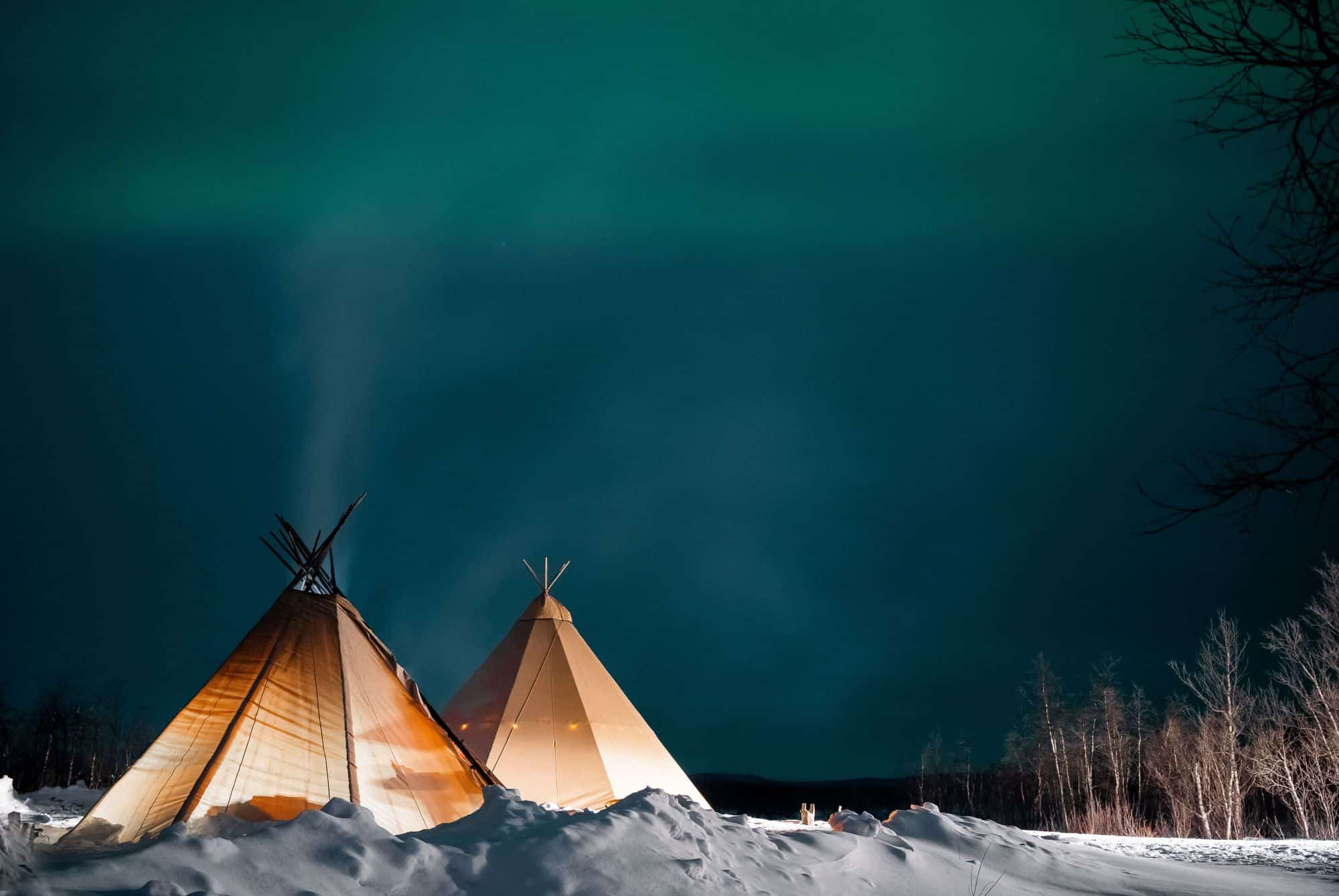 kota tent with northern lights above
