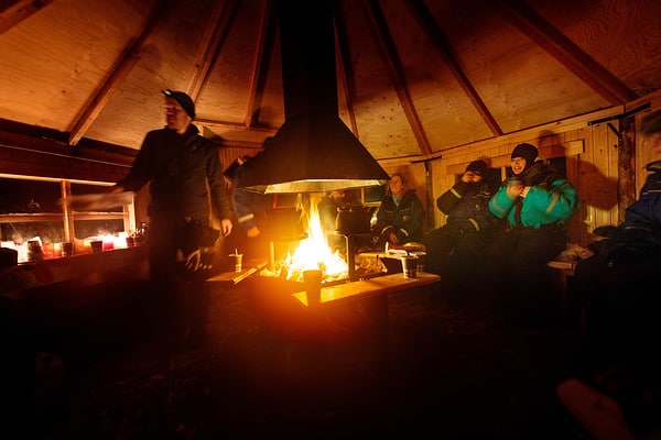 people sat round a camp fire