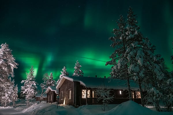 cabin with northern lights above