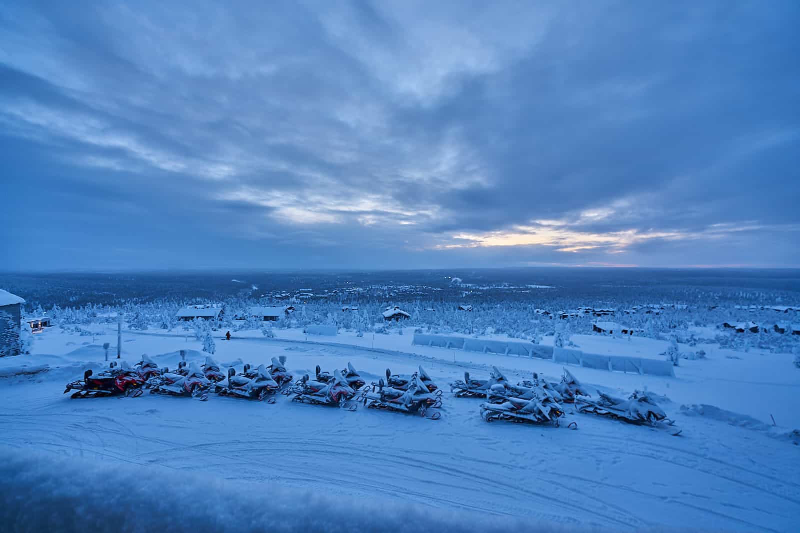landscape view of the forests with snowmobiles