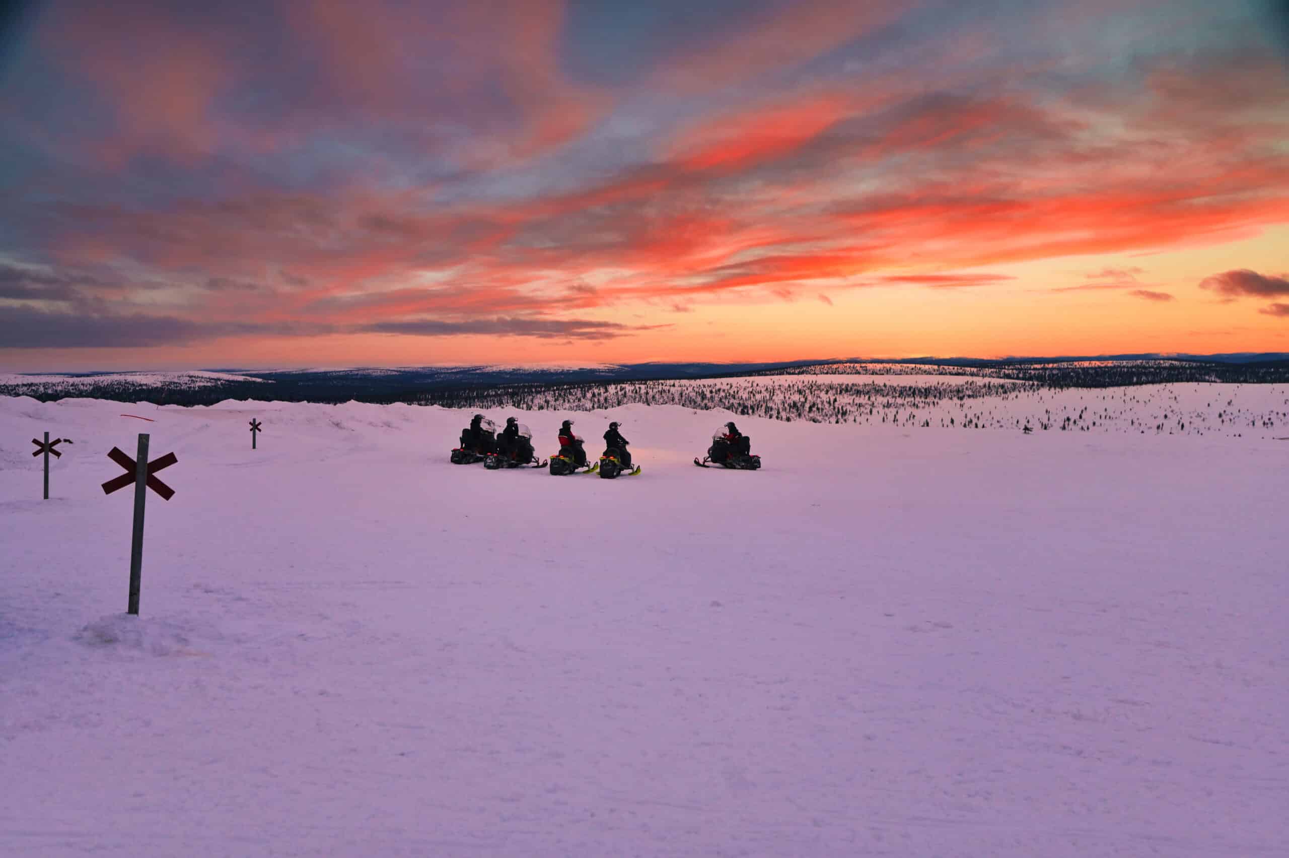 snowmobiling with sunset