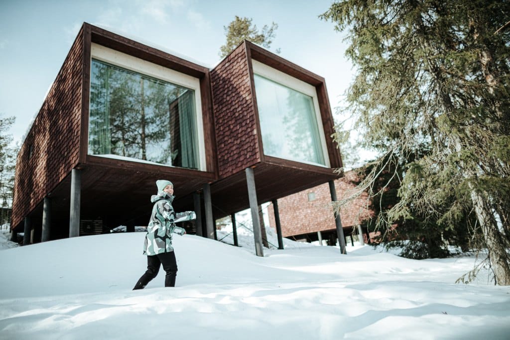 arctic treehouse hotel in the snow