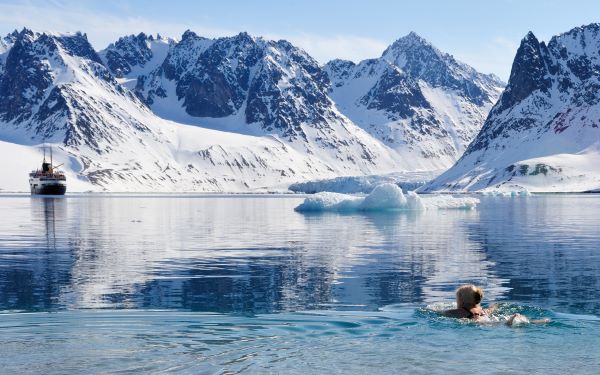 woman swimming in icy waters