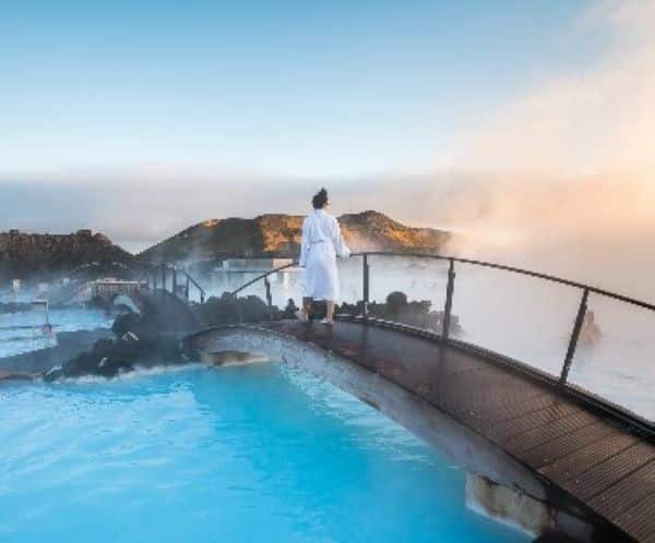 blue lagoon bridge with woman stood on it