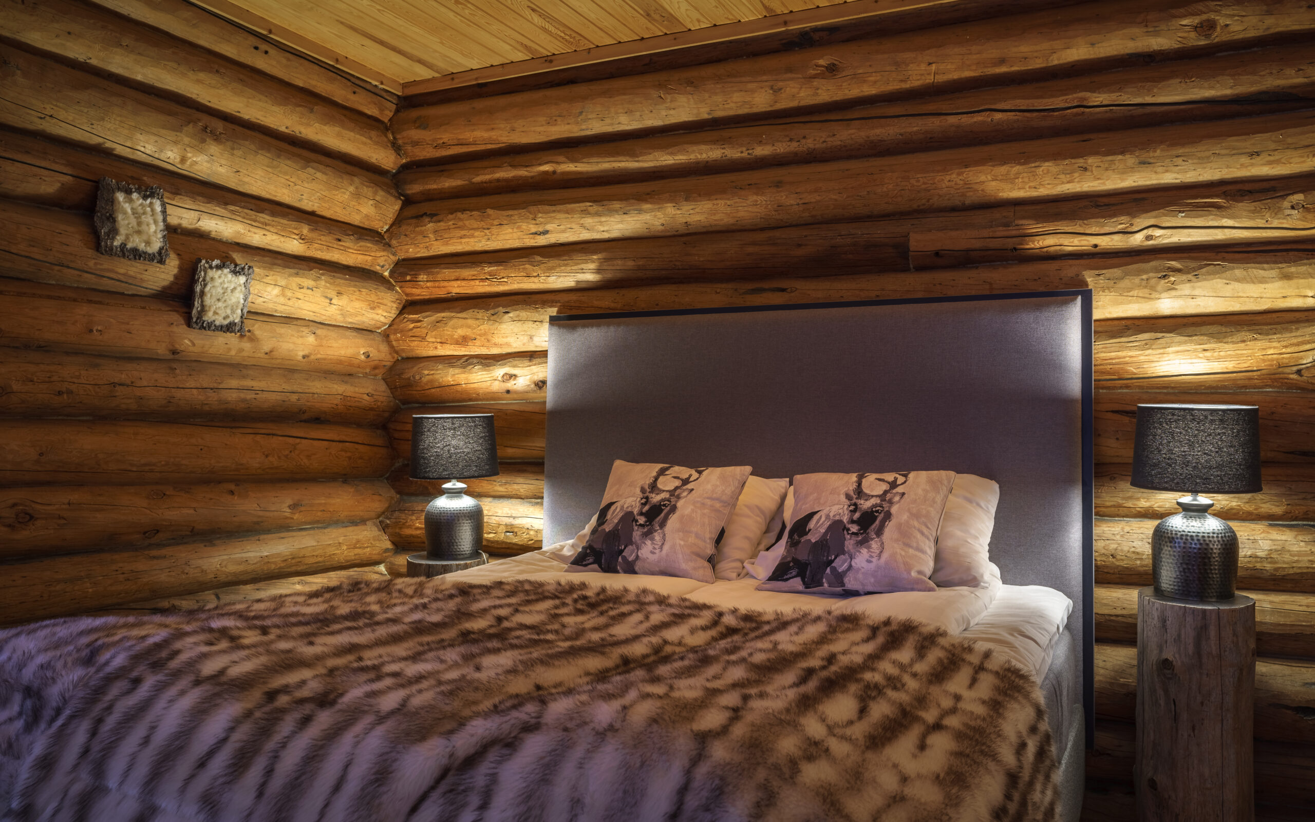 double bed in a log cabin