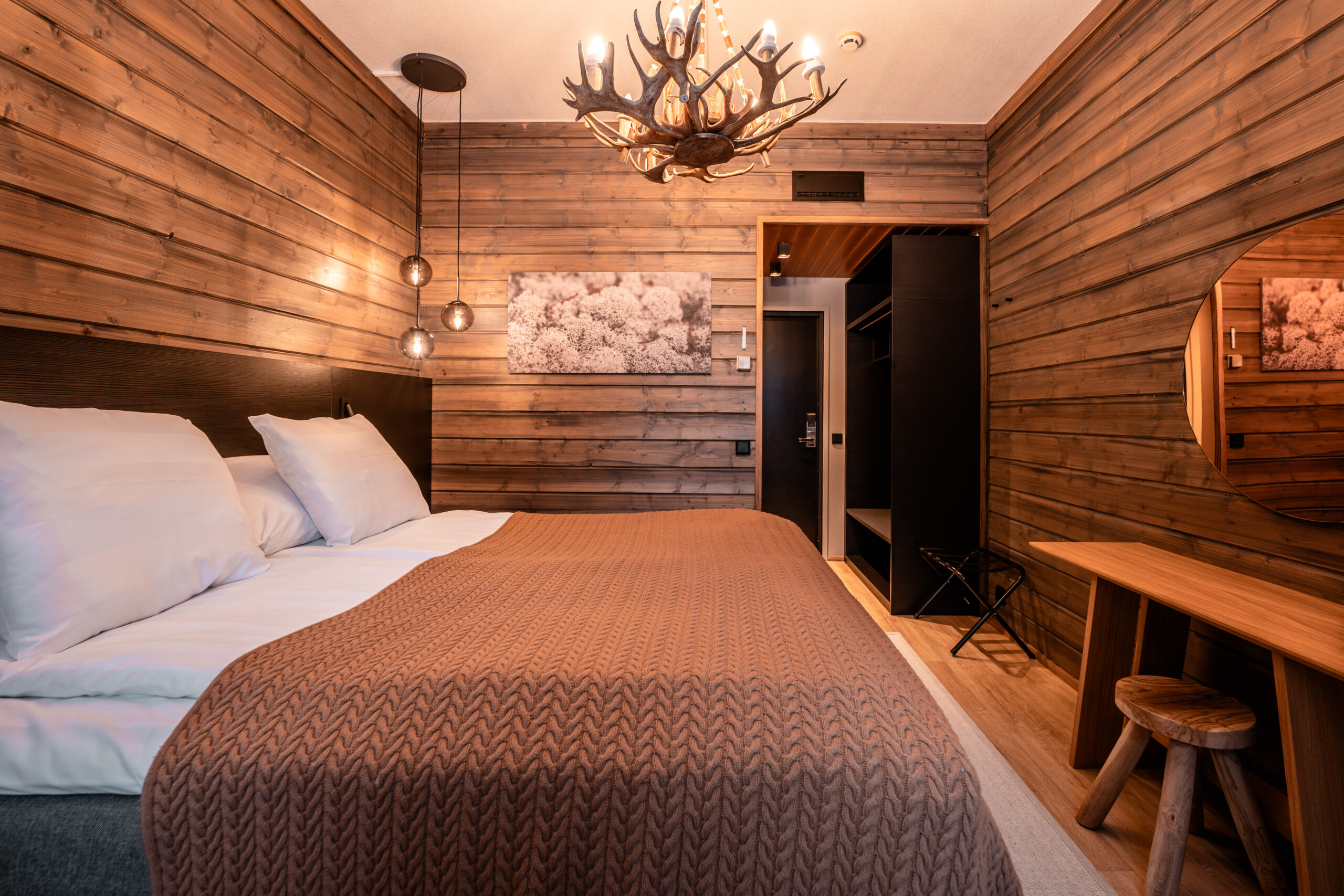 side view of wilderness room with double bed