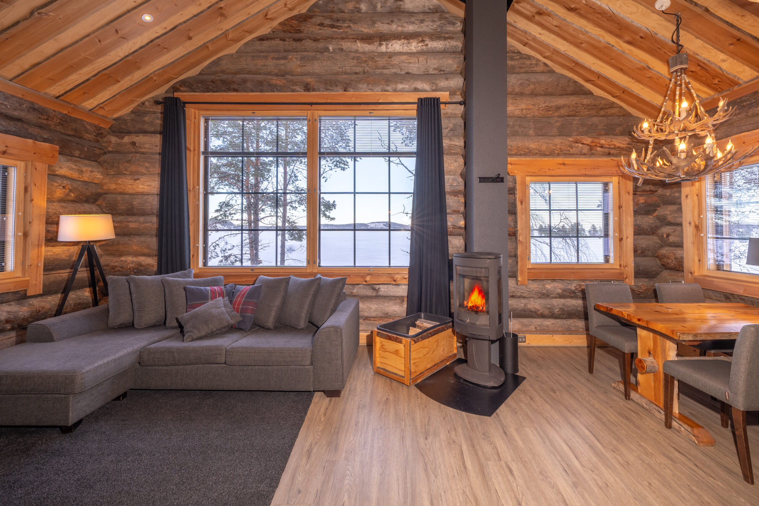 lounge/dining area with fire place in log cabin