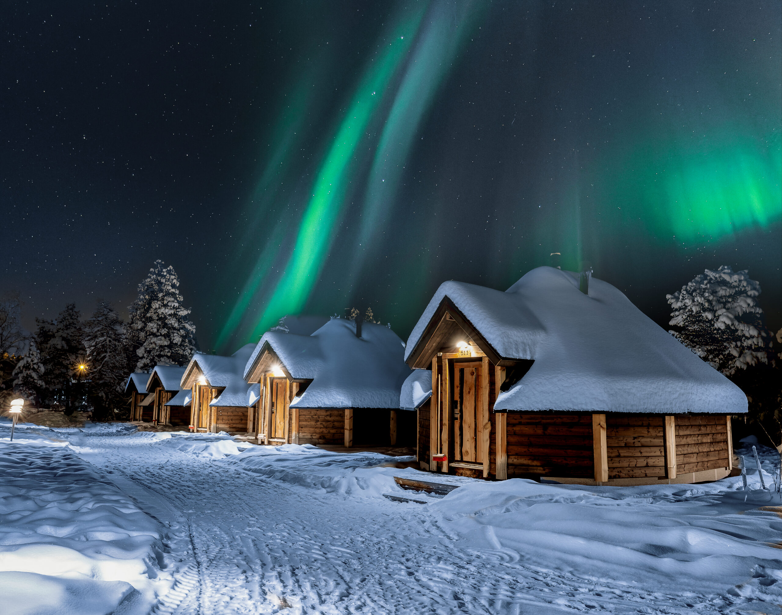 inari aurora cabin with northern lights above