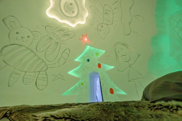 snow carvings on the wall in a snow room