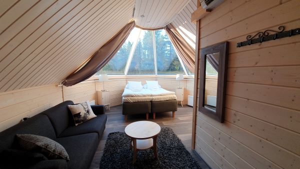 inside igloo with sofa and double bed