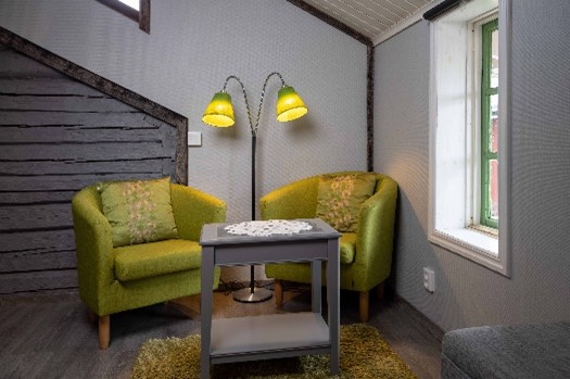 Aurora room Lapland Guesthouse seating area