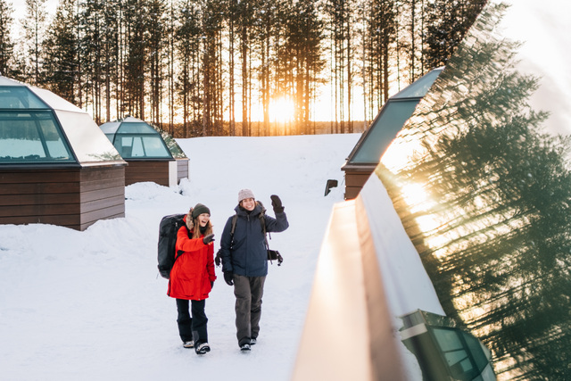 2 people walking together in the snow