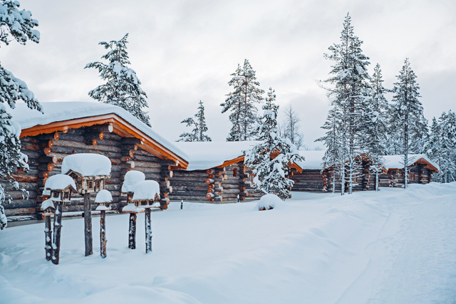 cabins in a line in the snow