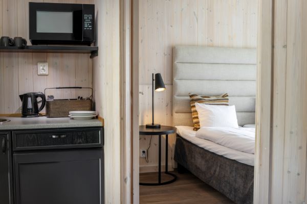 double bed with kitchenette view