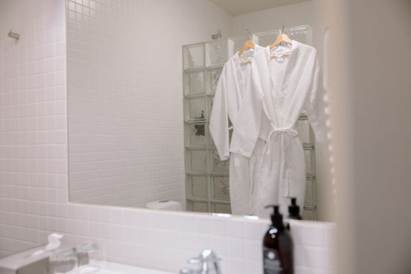 robes hanging on the shower