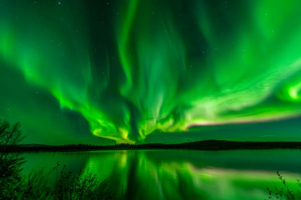 northern lights above the water