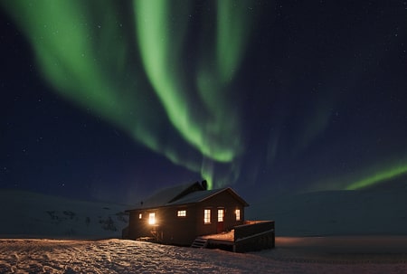 northern lights above a cabin