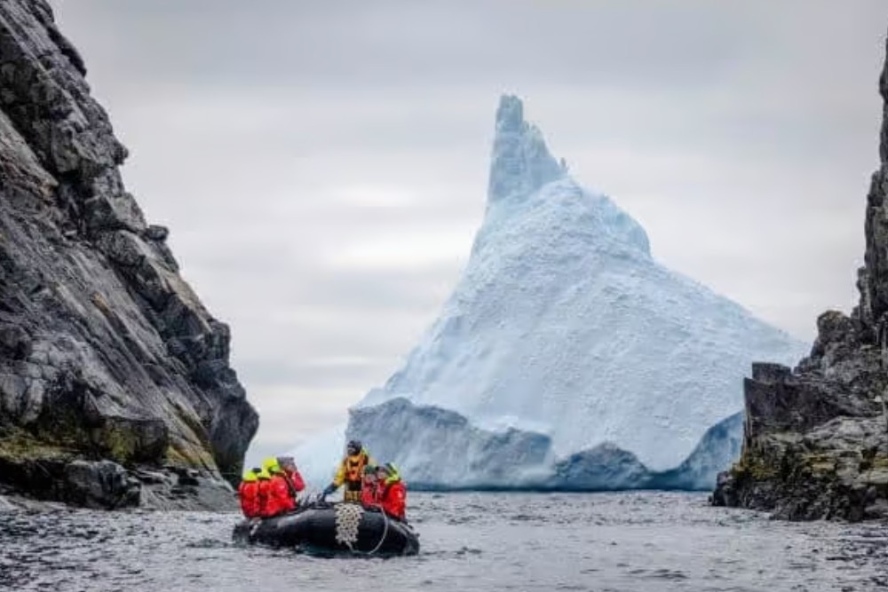 people on boat in antarctica
