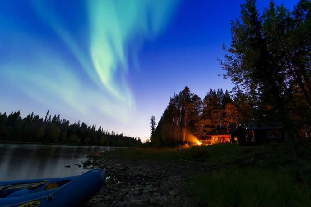 northern lights above river