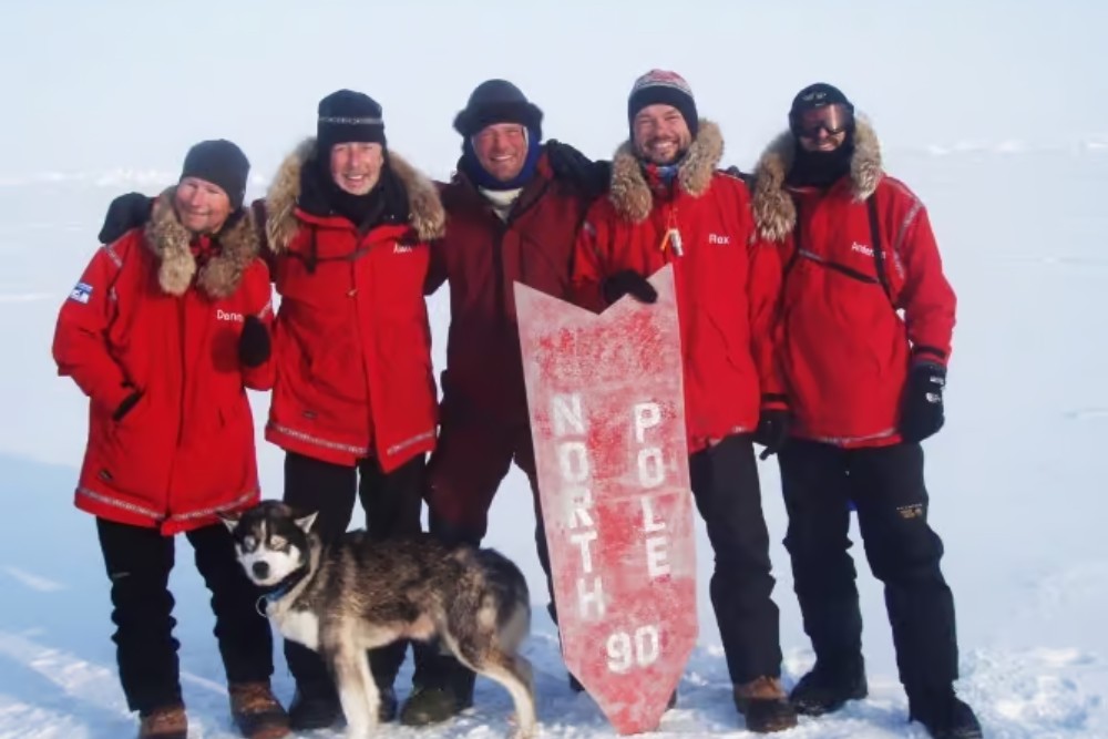 group of people stood together in the north pole