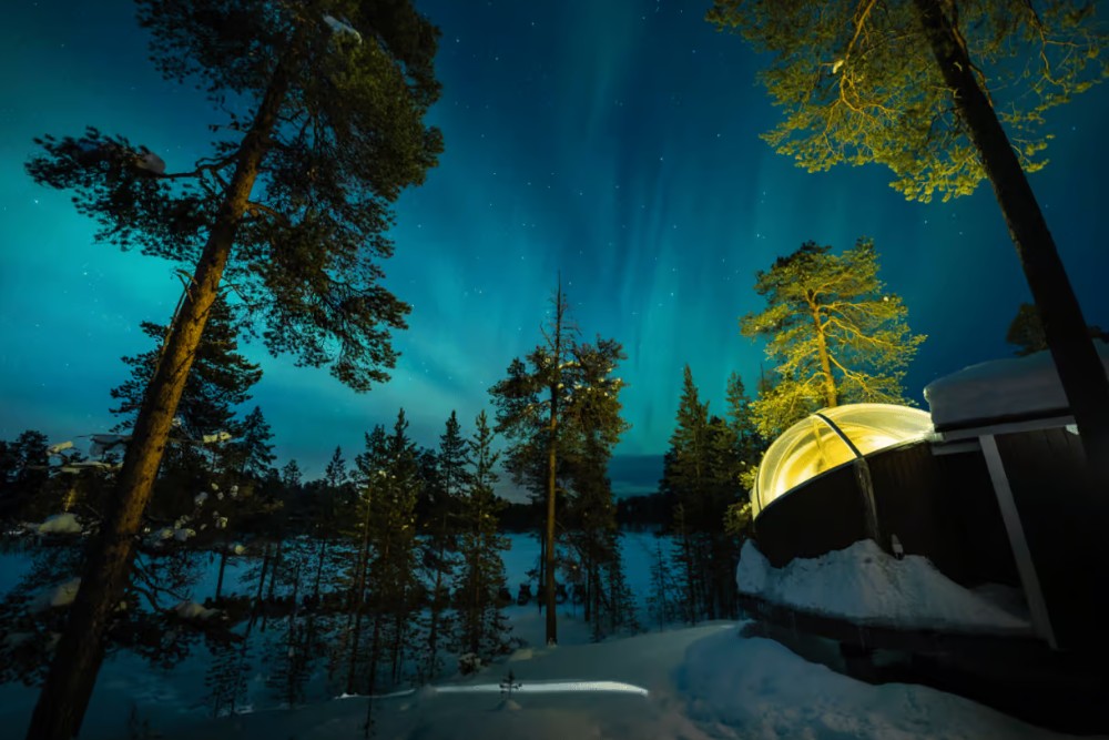 aurora bubble with northern lights above