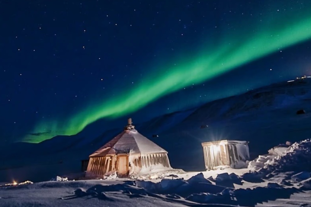 wilderness evening in svalbard with northern lights