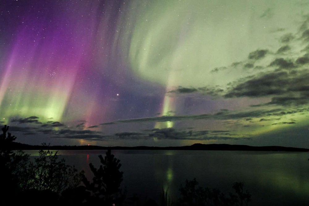 northern lights above lake