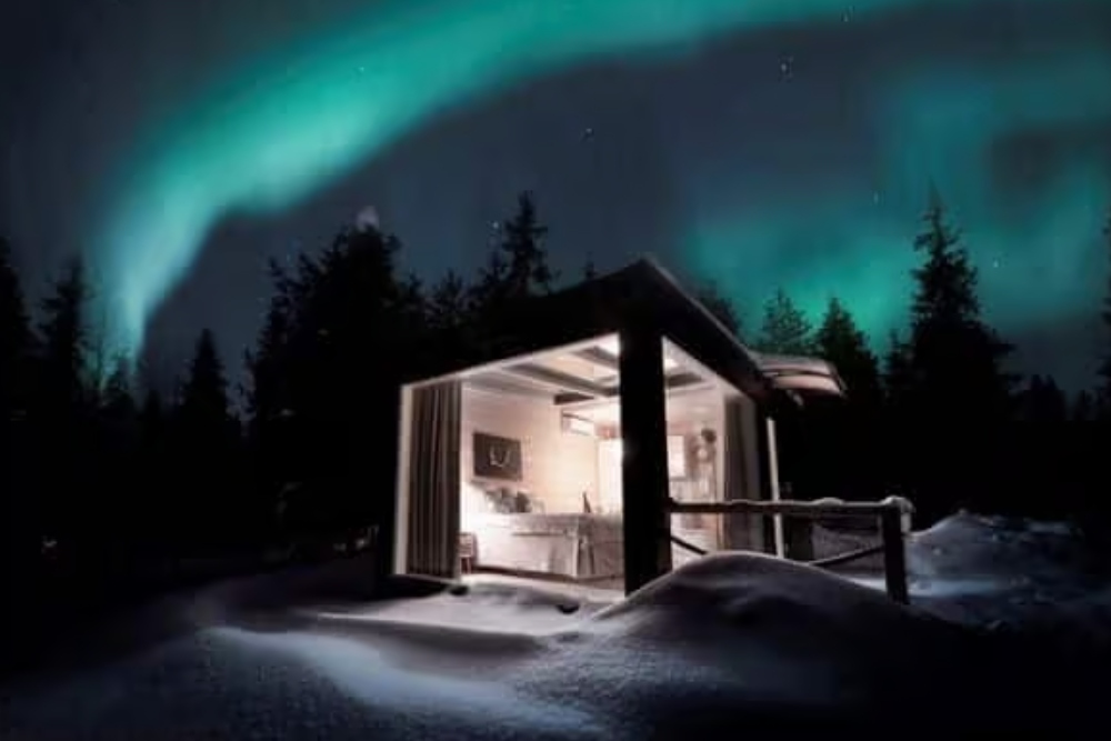 glass villa with northern lights above