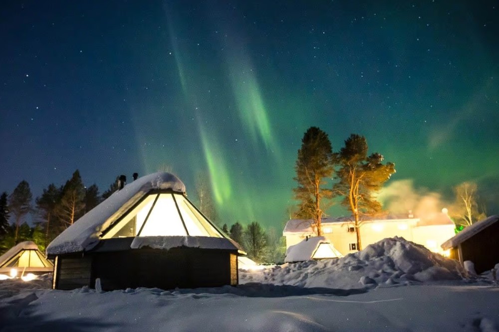 northern lights above glass igloos