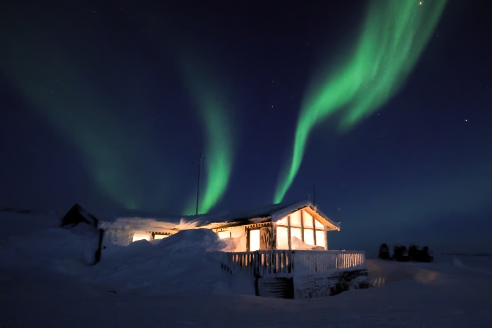 northern lights above cabin