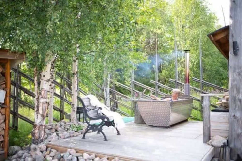 women in hot tub in the forest
