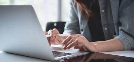 person typing on laptop