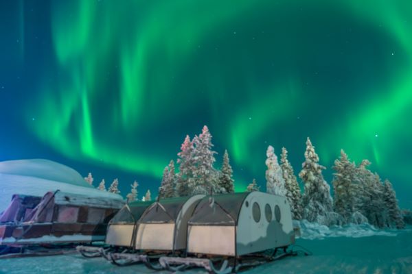 snowmobile sleigh with glass roof for viewing the northern lights