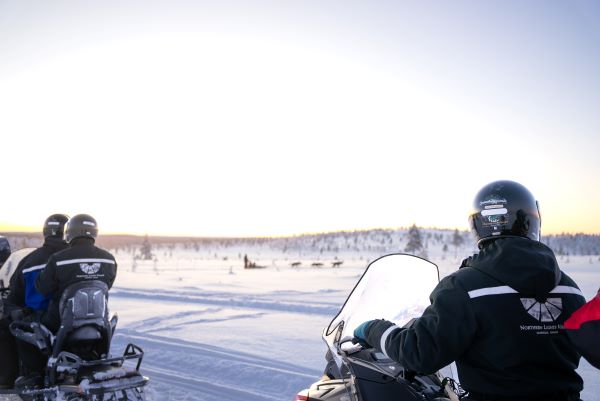 snowmobiling with snowy background