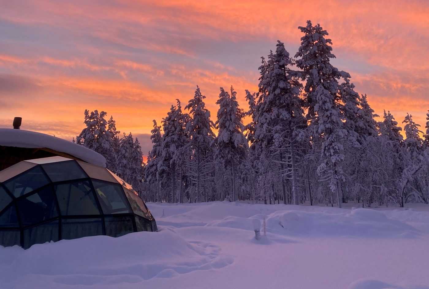 glass igloo with sunset